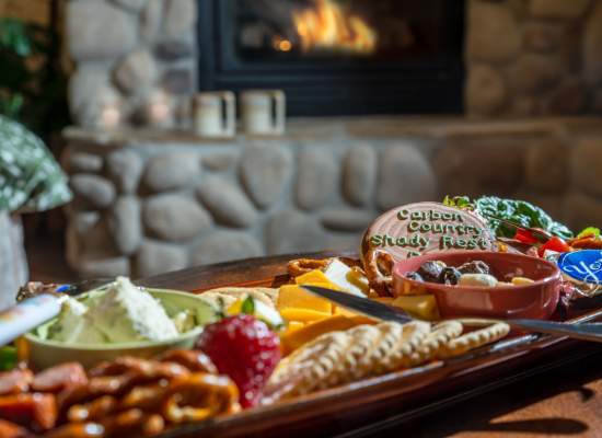 Bountiful chacuterie for two in front of the warm glowing fire.