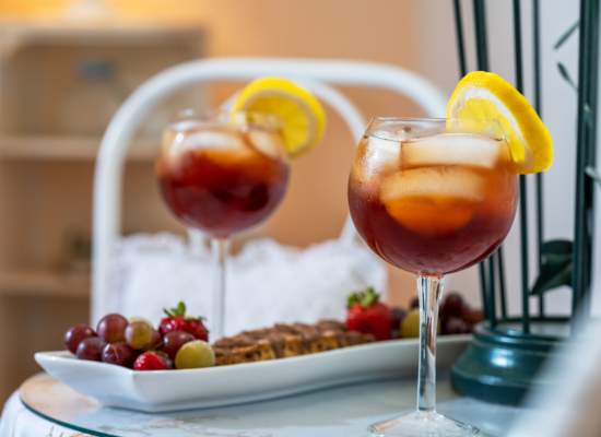 Iced Tea served with fresh fruit and homemade biscotti.